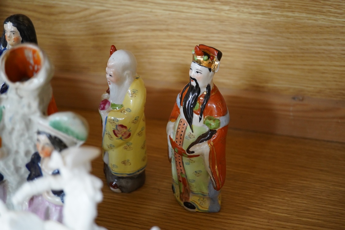 A collection of 19th century porcelain and ceramic figures, mostly Staffordshire, largest 28cm high